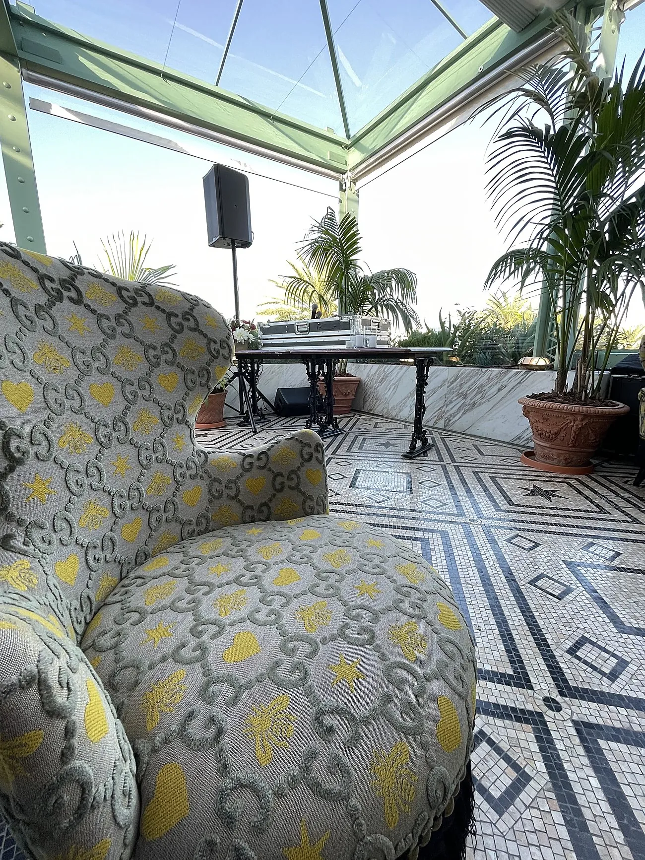Gucci-monogram armchair and AVE setup on the Osteria rooftop