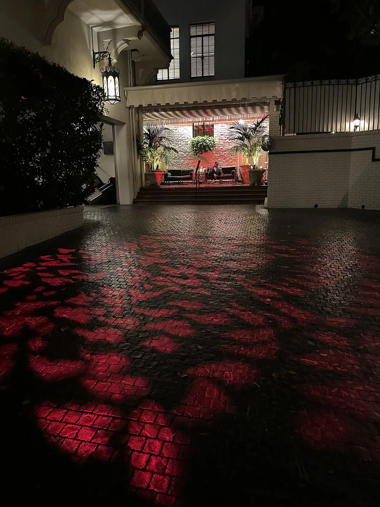 Terrace glowing at night during an event at the Chateau Marmont