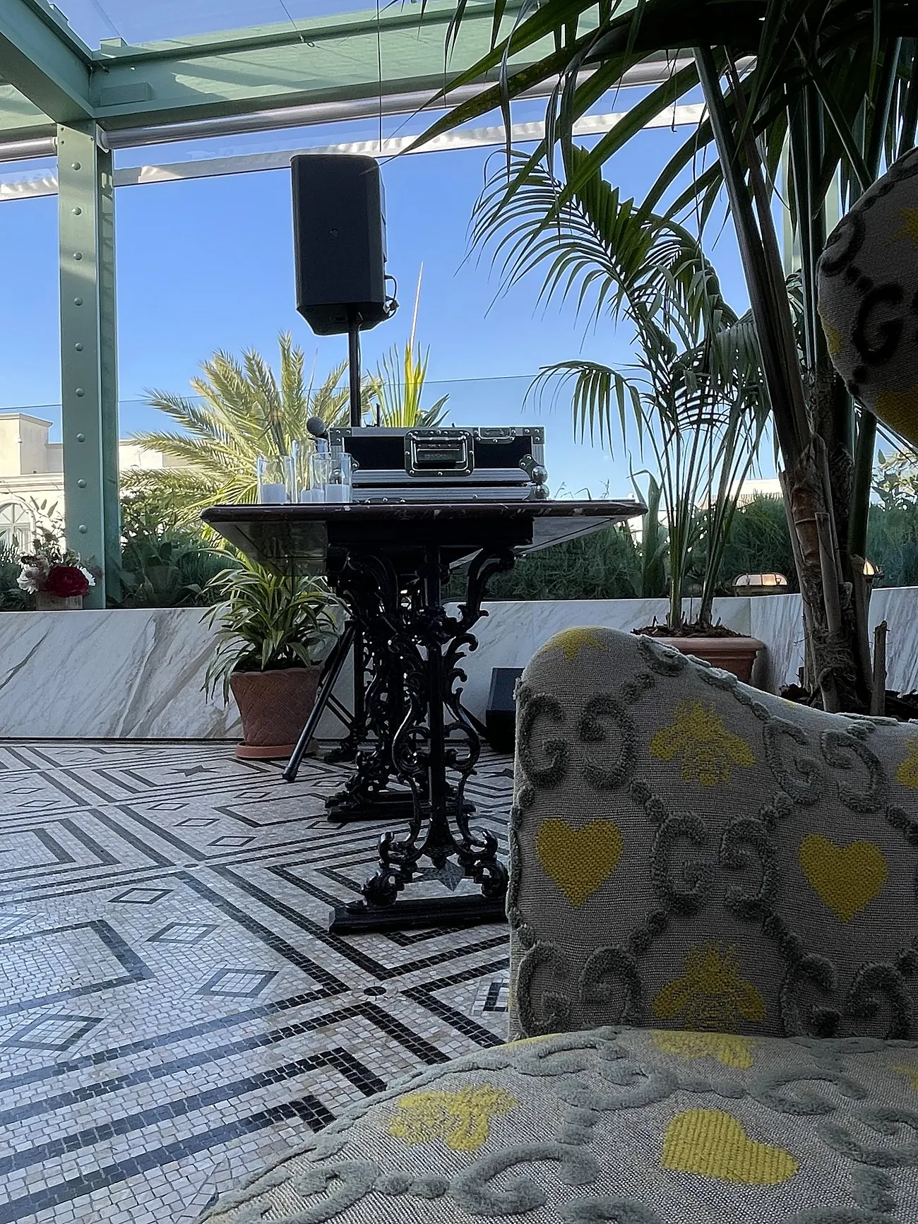 AVE speaker beside Gucci-monogram seating on the rooftop terrace