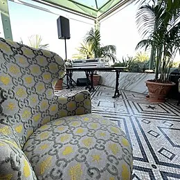 Gucci-monogram armchair on the Gucci Osteria rooftop