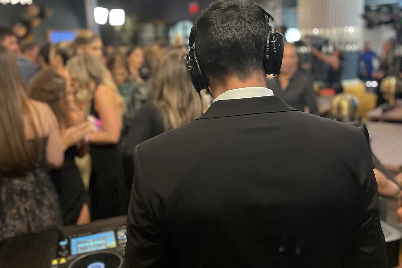 AVE DJ facing the room at an Oppenheim Group event
