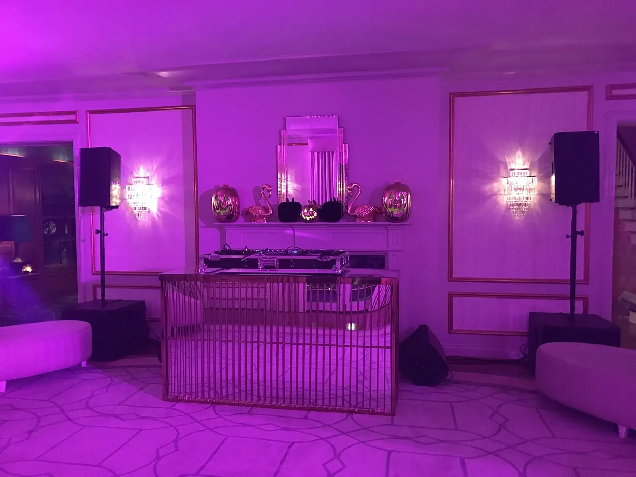 Purple-lit DJ lounge with AVE production