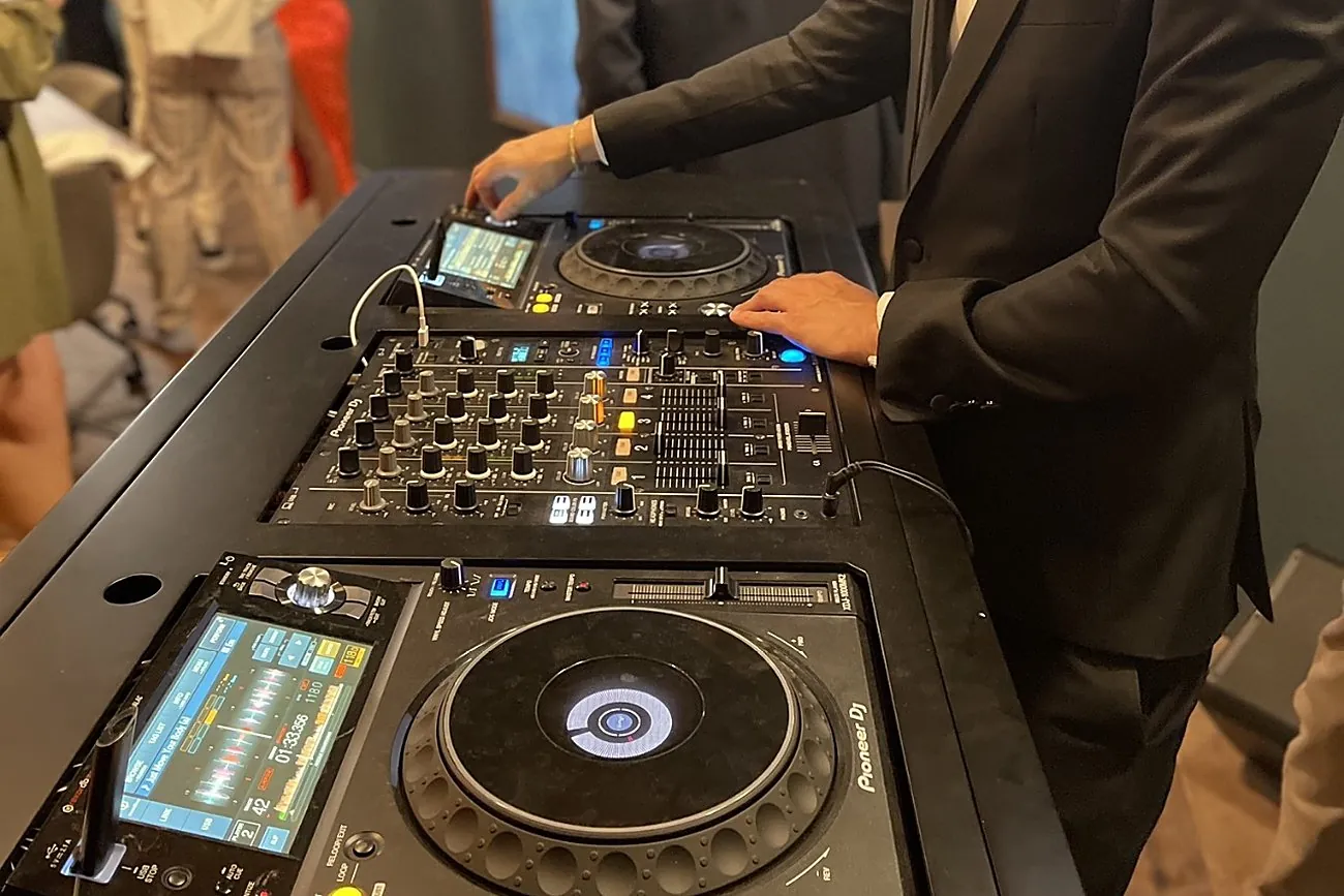 AVE DJ on the decks at an Oppenheim Group event