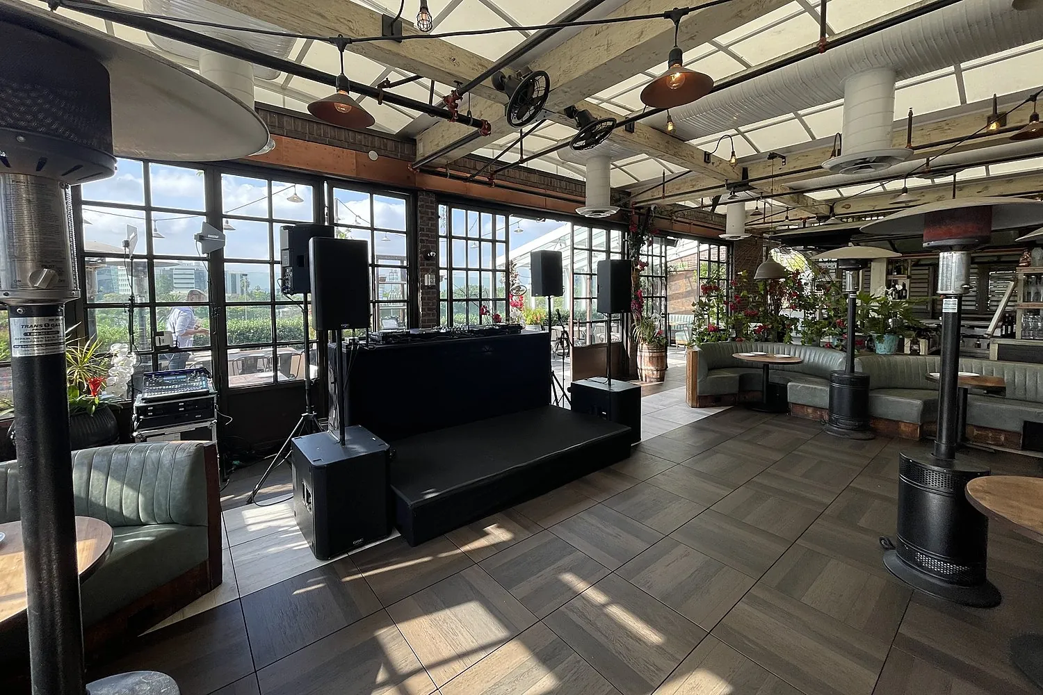 Rooftop event venue with lounge seating and AVE DJ setup