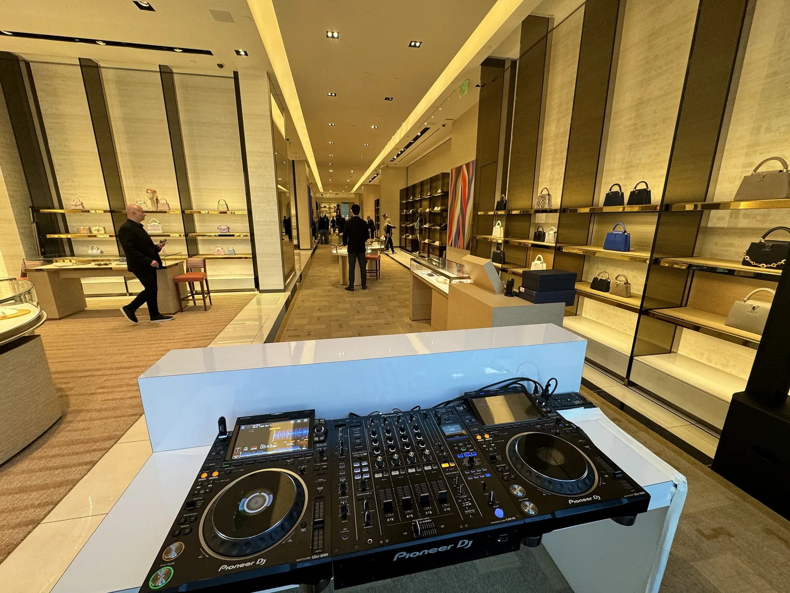 AVE DJ setup in the aisle of the Louis Vuitton store in Las Vegas