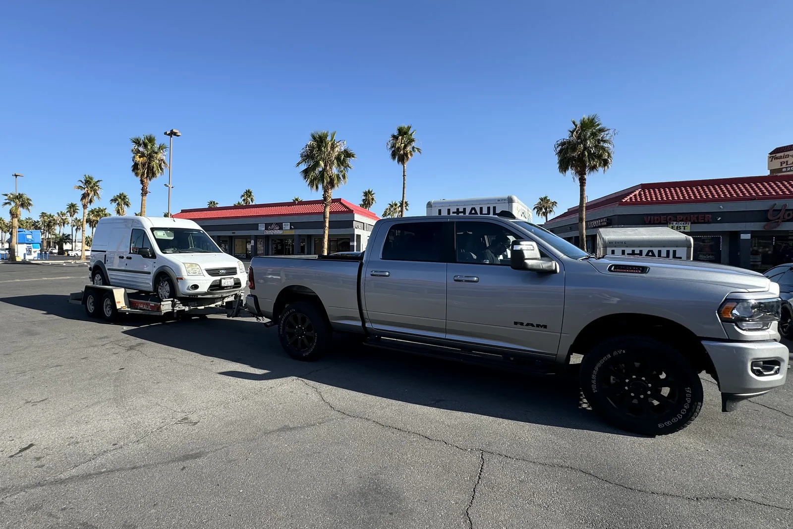A rented truck and trailer towing the AVE work van back to Los Angeles